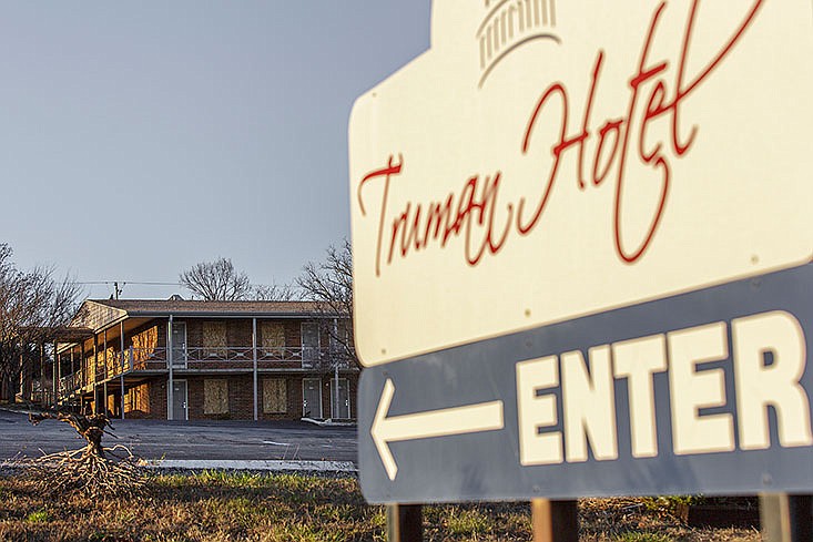 In this December 2015 file photo, one of the Truman Hotel's outer buildings is seen with windows boarded up after the Jefferson Street hotel closed its doors. 