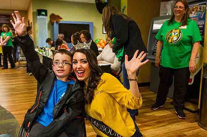 Submitted
Connor Strope, left, waves with Miss Missouri McKensie Garber at the Children's Miracle Network Radiothon on March 18 at the MU Women's and Children's Hospital.