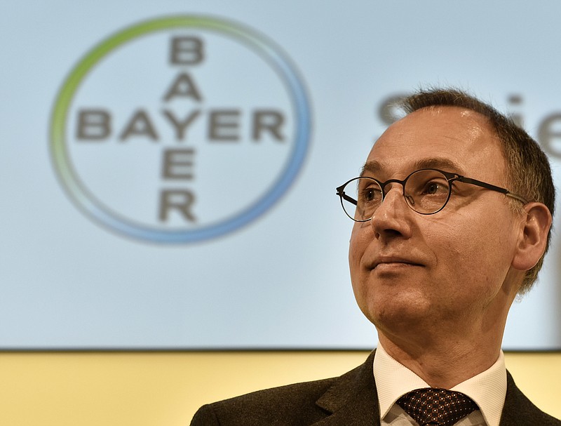 Ex-strategy chief Werner Baumann of Bayer watches the media at the annual press conference Feb 25 in Leverkusen, Germany. The company announced Monday that it has made a $62 billion offer to buy U.S.-based crops and seeds specialist Monsanto. 