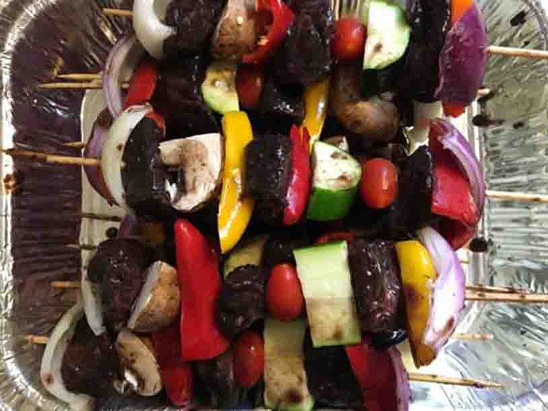 Steak kebabs marinated in blueberry barbecue sauce.