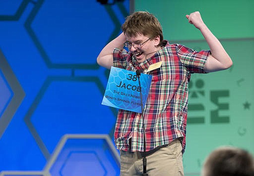 In this May 29, 2014, file photo, Jacob Williamson of Cape Coral, Fla., reacts after correctly spelling his word "harlequinade" during the semifinals of the Scripps National Spelling Bee in Oxon Hill, Md. He's been a coach to younger spellers, an official at local bees, a scout who identifies promising young talent and, at times, a vocal critic of Scripps. 