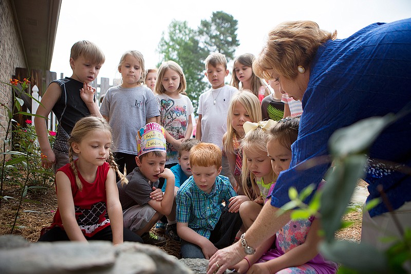 Kindergarten teacher Becky Barrett talks to her students Tuesday, May 24, 2016 about one of the water features in the Red Lick Elementary School butterfly garden. The three kindergarten classes at Red Lick Elementary completed the garden, which was three years in the making. Barrett and fellow teachers are hoping to register the garden with Texas as an official monarch way station. Texas is an important state in monarch migration because it is situated between the principal breeding grounds in the north and the wintering areas in Mexico.