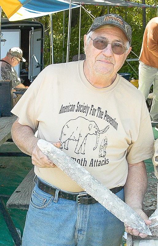 Bob Hunt holds one of the ceremonial flint knives he has made. It is from making this type of weaponry he has earned the nickname "Big Flint."