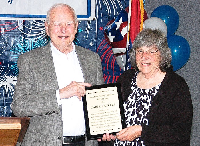 Gail Hughes, left, presents Carol Rackers the certification of her name being added to the Moniteau County Democrat Hall of Fame.