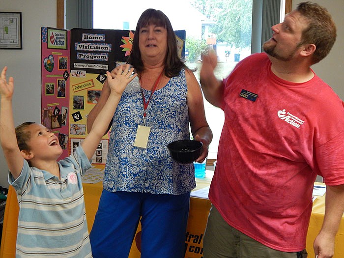 Alex Marquis, 6, visited Transformation Tuesday at Central Missouri Community Action and made two new friends, Connie Willenbury of Callaway Head Start and Cliff Atterberry, CMCA family development specialist. Besides blowing bubbles, the event offered more kids games and adult education about resources available in the area.