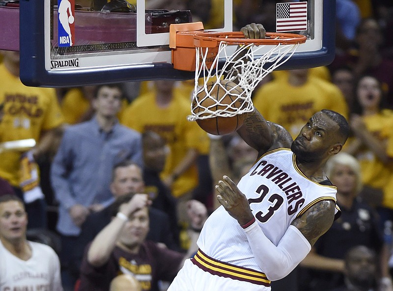 Cleveland Cavaliers forward LeBron James dunks against the Toronto Raptors during the first half of Game 5 of the NBA basketball Eastern Conference finals, Wednesday, May 25, 2016, in Cleveland. 