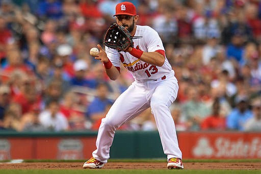 St. Louis Cardinals' third baseman Matt Carpenter (13) fields a ball against the Chicago Cubs in the second inning of a baseball game Monday, May 23, 2016, in St. Louis. 