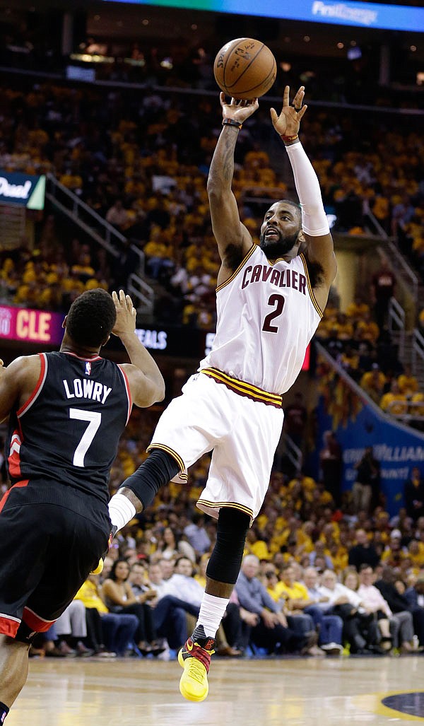 The Cavaliers' Kyrie Irving shoots over Kyle Lowry during the second half of Game 5 on Wednesday.