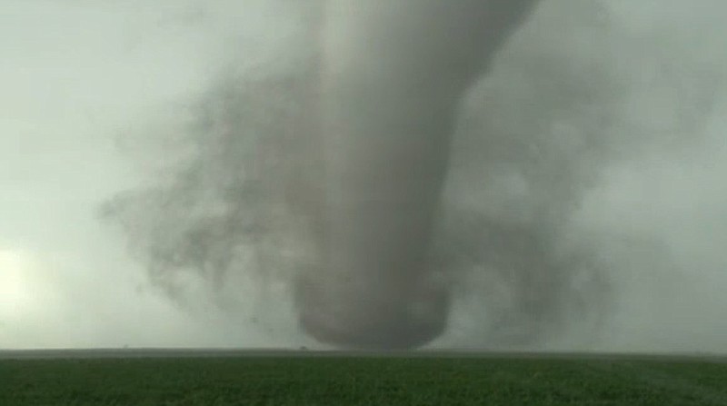 This image made from a Tuesday, May 24, 2016 video by KWTV-KOTV, shows a funnel cloud moving across the field near Dodge City in Ford County, Kan. Crews are evaluating the damage Wednesday after tornadoes destroyed several homes in western Kansas as a series of severe storms swept across the Plains. 