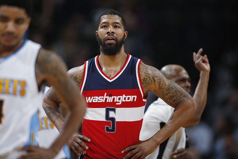 In this March 12, 2016, file photo, Washington Wizards forward Markieff Morris (5) pauses during the team's NBA basketball game against the Colorado Nuggets, during a stoppage in play. A person familiar with the situation says Morris was detained at Philadelphia International Airport and then released. The person spoke to The Associated Press on condition of anonymity Thursday, May 26, 2016, because Morris was not charged. The person did not specify why Morris was detained. The Wizards said in a statement they "spoke with Markieff earlier today and will continue to gather more details." 