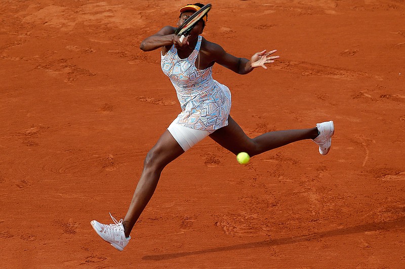 Venus Williams of the U.S. returns the ball to compatriot Louisa Chirico during their second round match of the French Open tennis tournament at the Roland Garros stadium, Thursday, May 26, 2016 in Paris. 