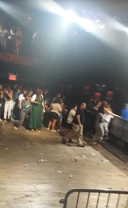 This image made from a video shows people inside Irving Plaza, near Manhattan's Union Square in New York after a shooting Wednesday. Police say several were injured in a deadly shooting inside the concert venue, where hip-hop artist T.I. was scheduled to perform.