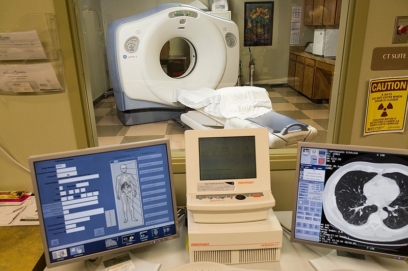 A computerized axial tomography scan machine at Wadley Advanced Imaging on Summerhill Road and Moores Lane in Texarkana, Texas, shows a cross section of lungs, the heart, ribs and a sternum. The machine and low-dose radiation makes screening for lung cancer easy.
