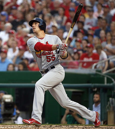 St. Louis Cardinals' Stephen Piscotty watches his grand slam off Washington Washington Nationals starting pitcher Max Scherzer during the third inning of a baseball game at Nationals Park, Friday, May 27, 2016, in Washington.