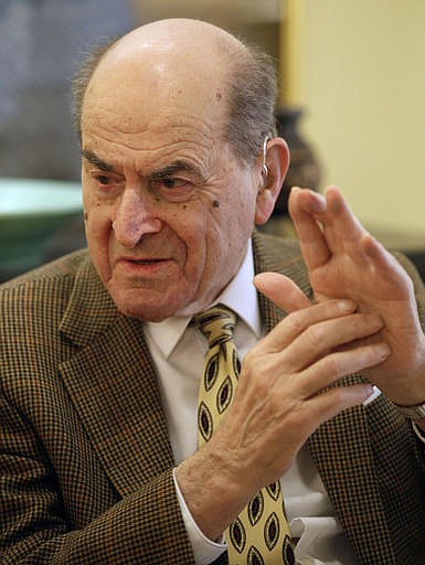 In this Feb. 5, 2014 file photo, Dr. Henry Heimlich describes the maneuver he developed to help clear obstructions from the windpipes of choking victims, while being interviewed at his home in Cincinnati.