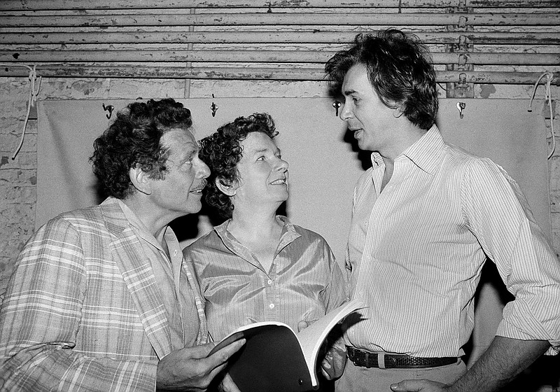 In this Aug. 18, 1980, file photo, actor Frank Langella, right, talks with Jerry Stiller, left, and Angela Paton at the Morosco Theater in New York. Paton, best known for appearing with Bill Murray in "Groundhog Day," has died at age 86. Her nephew George Woolf says Paton died Thursday, May 26, 2016. (