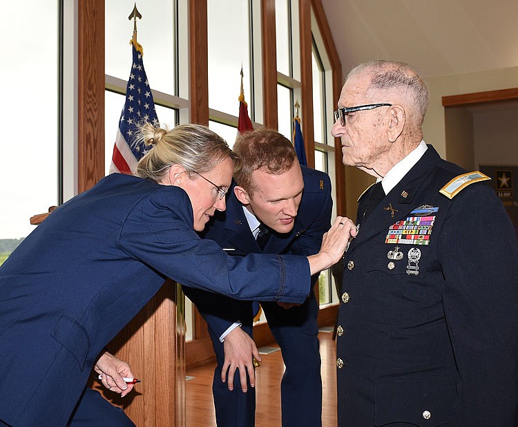 Prior to Friday's retirement ceremony, Lt. Col. Peggy Milam, left, and her son, 2nd Lt. Christian Heimlich,
both of the USAF, look closely at her father, Col. Lloyd Cain's military medals. Milam officially retired from
the U.S. Air Force Medical Service in a small ceremony at Danner Chapel in the Resiliency Center at the
Missouri National Guard Headquarters. She retired after more than 25 years in the Air Force, concluding her
service as director of operations for the 382nd TRS at Fort Sam Houston, Texas.