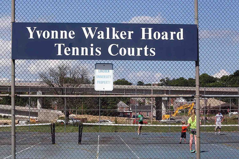 A family plays tennis at Lincoln University's Yvonne Walker Hoard Tennis Courts on Thursday, May 26, 2016. The university is planning a renovation of the courts.