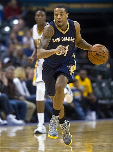 In this Oct. 3, 2015, file photo, New Orleans Pelicans' Bryce Dejean-Jones (31) races the ball up court during the first half of a preseason NBA basketball game against the Indiana Pacers in Indianapolis. Police say Saturday, May 28, 2016, Dejean-Jones was fatally shot after breaking down the door to a Dallas apartment. 