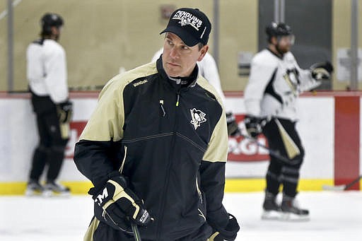 Pittsburgh Penguins head coach Mike Sullivan skates with the team during NHL hockey practice at the UPMC Lemieux Sports Complex, Saturday, May 28, 2016, in Cranberry, Pa.