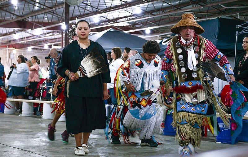 Native American men and women, both young and old, perform a ceremonial dance before the grand entry of the For the People Pow Wow on Saturday, May 28, 2016 at the Jefferson City Jaycees Fairgrounds.