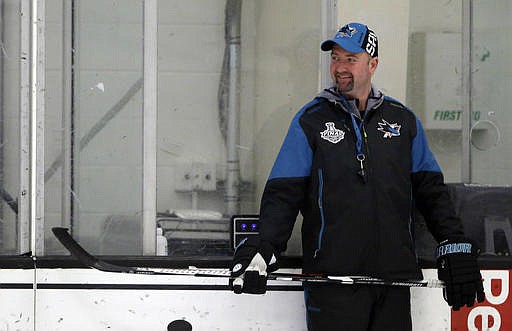 San Jose Sharks head coach Peter DeBoer smiles during an NHL hockey practice Friday, May 27, 2016, in San Jose, Calif. San Jose will play Pittsburgh in the Stanley Cup Final. 