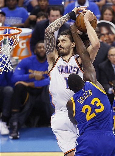 Golden State Warriors forward Draymond Green (23) goes after the ball as Oklahoma City Thunder center Steven Adams (12) shoots during the first half in Game 6 of the NBA basketball Western Conference finals in Oklahoma City, Saturday, May 28, 2016. 