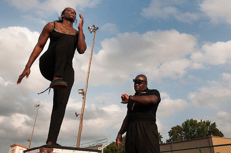 Local mixed martial arts fighter Keyona Noel works with her trainer Jeff Pickett on Wednesday, May 25, 2016 at the Texas High's track. Noel and Pickett have been working together for four months.