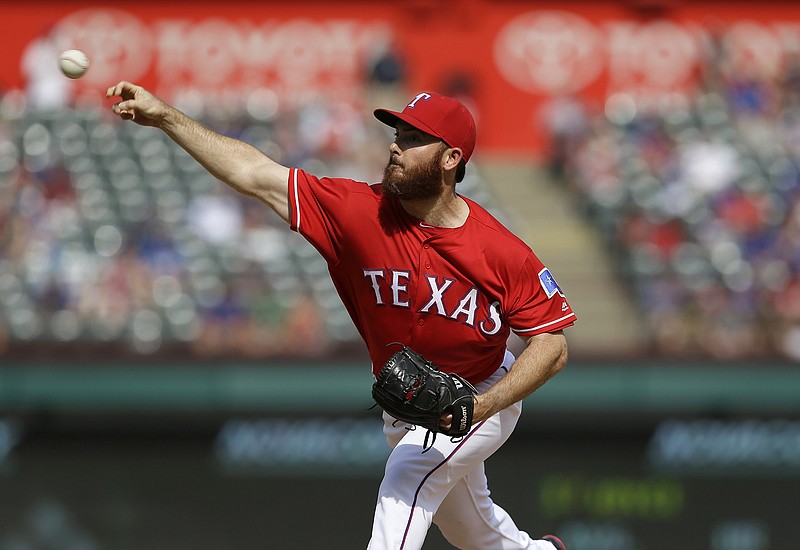 Texas Rangers closer Sam Dyson throws during the ninth inning of the baseball game against the Pittsburgh Pirates in Arlington, Texas, Sunday, May 29, 2016. 