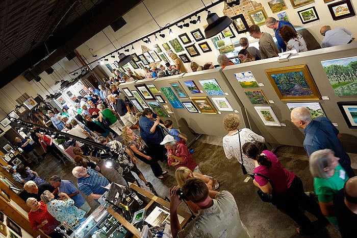 More than 100 artists and art fans came out Sunday evening to the Art House in Fulton. The reception was the culmination of the group's 'plein air' competition in which artists painted Callaway County scenes out on site during the long Memorial Day weekend.