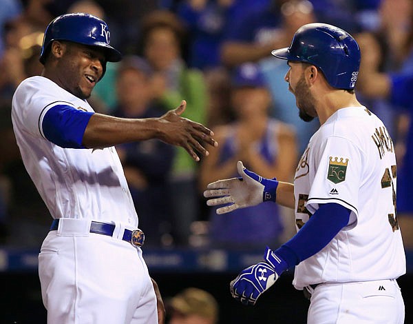 Lorenzo Cain (left) congratulates Royals teammate Eric Hosmer after his three-run home run during the eighth inning of Monday night's game against the Rays at Kauffman Stadium. The Royals scored four runs in the eighth to defeat the Rays 6-2.