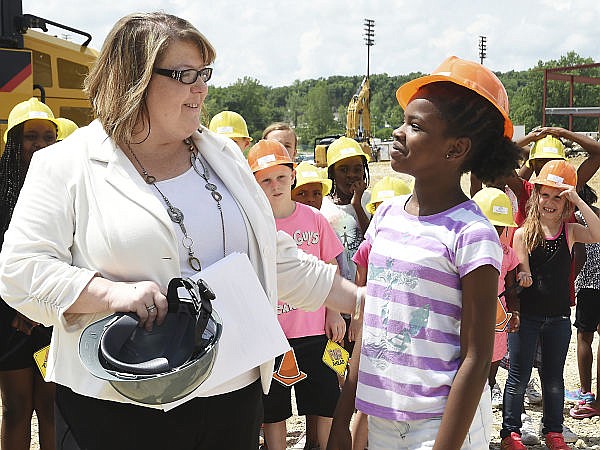 When asked by Stephanie Johnson, executive director, what she looks forward to most at the new Boys & Girls Club, Cheria Galbreath, right, said she is excited about the new computer lab and to have fun. The Boys & Girls Club (BGC) of the Capital City hosted a press event Wednesday to announce that ground has been broken for its new $3.1 million dollar facility to be built on Lafayette Street. 