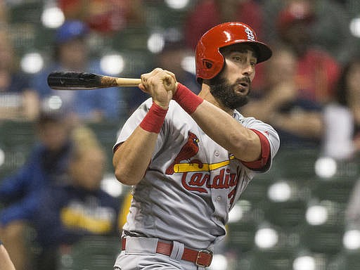 St. Louis Cardinals' Matt Carpenter follows through on a his fourth hit of the game and second triple off of Milwaukee Brewers' Jahn Mariez during the eighth inning of a baseball game Tuesday, May 31, 2016, in Milwaukee.