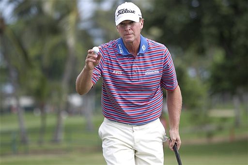 In this Jan. 15, 2016, file photo, Steve Stricker waves to the gallery on the 12th green during the second round of the Sony Open golf tournament in Honolulu.