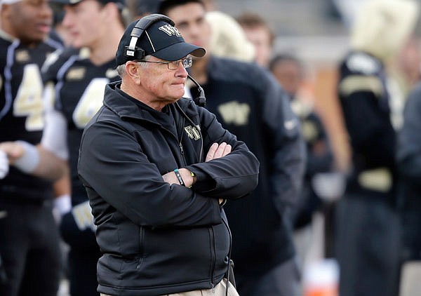 In this Nov. 23, 2013, file photo, Wake Forest coach Jim Grobe looks on during the second half of a game against Duke in Winston-Salem, N.C.