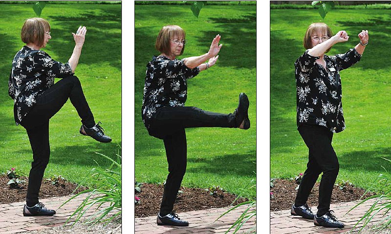 Judy Baumgartner demonstrates Tai Chi poses in the Missouri Governor's Garden.