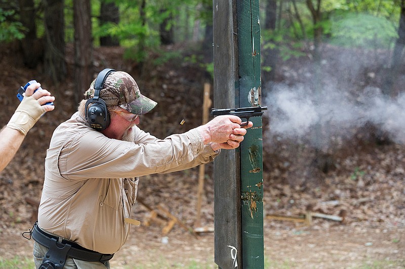 Jay Tucker of DeKalb, Texas, fires a handgun Saturday, June 4, 2016 during the Take Your Choice event as part of U.S. Practical Shooting Association classification at the Texarkana Gun Club in Maud, Texas. The USPSA ranks members on their speed and accuracy. Shots per second is measured with an audio timing device and then factored with shot accuracy. Each shooter is then ranked against the rest of the nation shooting in identical conditions. Tucker scored 2.0758.