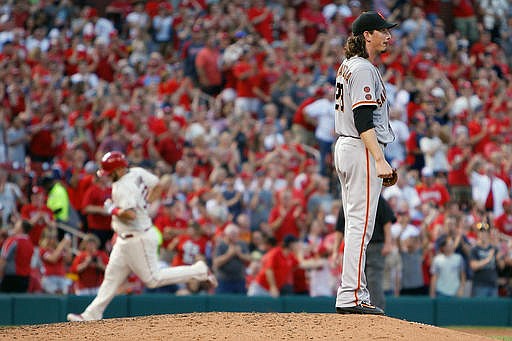 San Francisco Giants starting pitcher Jeff Samardzija, right, pauses on the mound as St. Louis Cardinals' Matt Adams runs the bases after hitting a solo home run during the sixth inning of a baseball game Saturday, June 4, 2016, in St. Louis. 