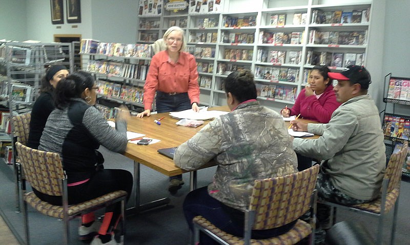 In this photo submitted June 5, 2016, instructor Paulette Fischer teaches English to a small group of English as a second language students at the Moniteau County Library @ Wood Place in California, Mo.