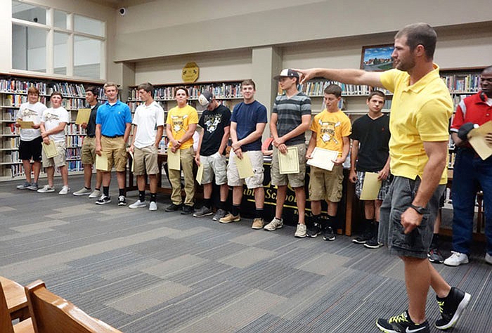 Coach John Brinkmann introduces the Fulton High School baseball team at the School Board meeting Wednesday.