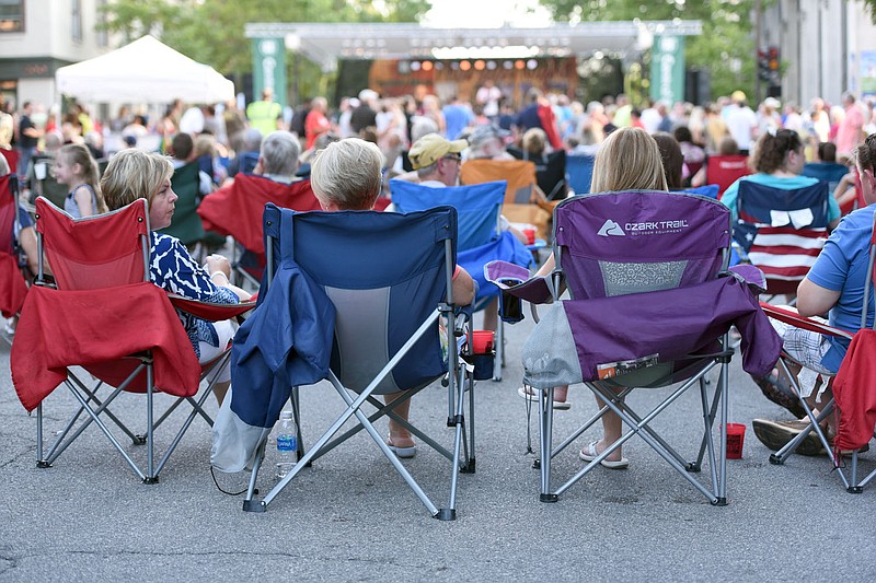 Concertgoers bring fold-out chairs to Thursday Night Live on June 9, 2016. 