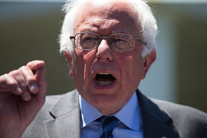 Democratic presidential contender Bernie Sanders speaks to reporters after his Thursday meeting with President Obama.