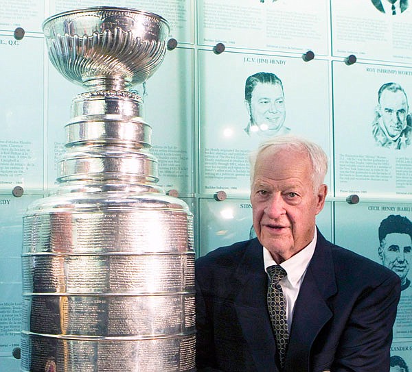 In this Nov. 14, 2011, file photo, Hockey Hall of Famer Gordie Howe poses beside the Stanley Cup at the Hall of Fame in Toronto. Howe, whose boundless blend of talent and toughness made him the NHL's quintessential star during a career that lasted into his 50s, died Friday. He was 88.