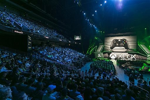 In this June 15, 2015 file photo, Phil Spencer, head of Microsoft's Xbox division and Microsoft Studios, opens the Xbox E3 2015 briefing ahead of the Electronic Entertainment Expo at the University of Southern California's Galen Center in Los Angeles. From virtual reality to the latest installments of "Gears of War" and "Battlefield," the newest hardware and software will be hyped by nearly 300 exhibitors at the Electronic Entertainment Expo, the gaming industry's annual trade show kicks off Sunday, June 12, 2016. 