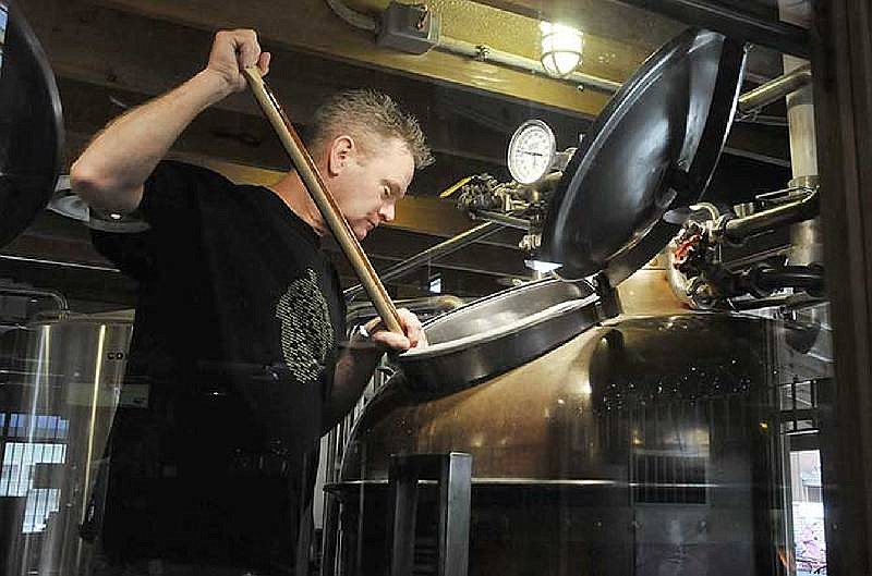 In this May 11, 2014 file photo, brew master Rod Dorthage peers into a large copper tank used for beer brewing at Prison Brews in Jefferson City.