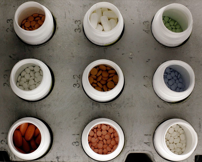 FILE: Various prescription drugs are seen on the automated pharmacy assembly line at Medco Health Solutions in Willingboro, New Jersey.