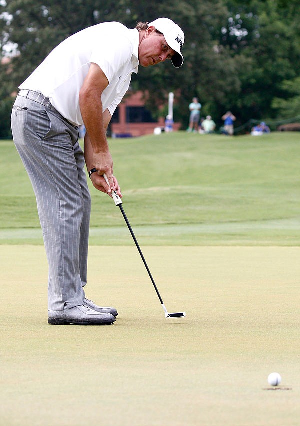 Phil Mickelson watches his putt roll in for a birdie on the eighth hole of the final round Sunday of the FedEx St. Jude Classic in Memphis, Tenn. Mickelson, who turns 46 today, finished runner-up with a 10-under 270.