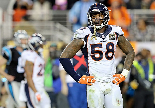 In this Feb. 7, 2016, file photo, Broncos linebacker Von Miller looks toward the sideline during Super Bowl 50 against the Panthers in Santa Clara, Calif.  The Broncos' summer break began with an ominous message from superstar Von Miller. The Super Bowl MVP suggested he'll sit out the 2016 season if general manager John Elway doesn't meet his contract demands in the next month. 