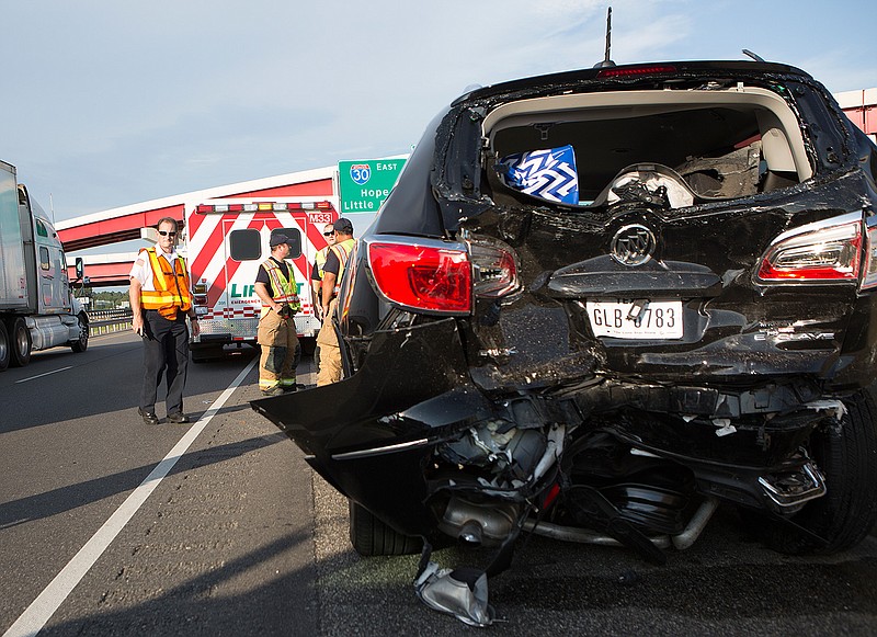 Texarkana, Ark., first responders work a fatal accident Friday, June 17, 2016 at mile marker three on Interstate 30.
