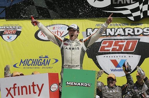 Daniel Suarez yells after winning the NASCAR Xfinity series auto race at Michigan International Speedway, Saturday, June 11, 2016 in Brooklyn, Mich.